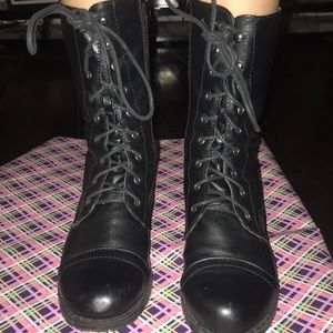 Black booted with straps all the up